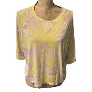 Fabletics flourescent yellow and purple swirls on a cream tee. NWOT.